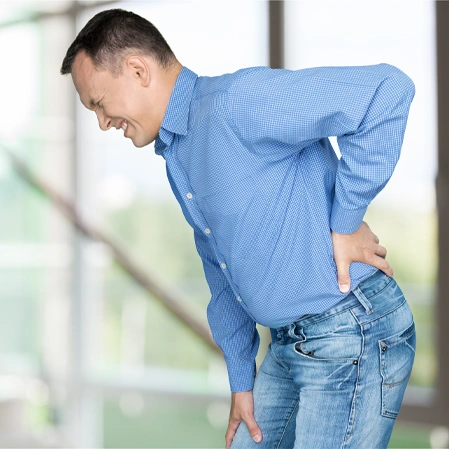 Person Holding The Lower Back To Illustrate Acute Back Pain